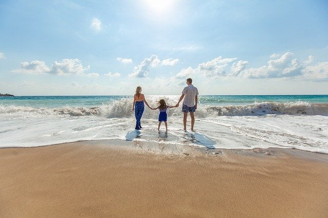 Beach family fun waves coming in Image by Pexels from Pixabay 