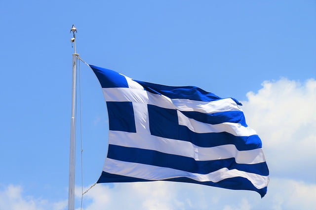 Greece flag in the wind Image by Reissaamme from Pixabay 