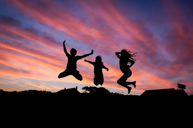 People jumping in the air sunset silhouette Image by fancycrave1 from Pixabay
