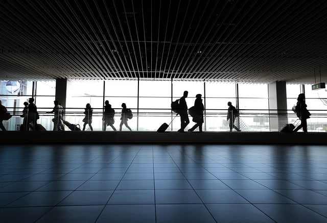 Passengers walking at the airport Image by Rudy and Peter Skitterians from Pixabay 