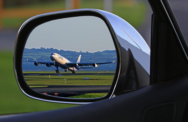 Airplane taking off in the rearview mirror Image by Holger Detje from Pixabay 