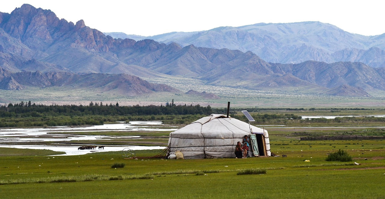 Mongolian yurt with rugged scenery in the background image by pixabay user jackmac34